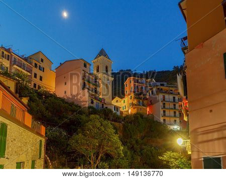 The old narrow street in the medieval Italian village of Manarola at night. Parco Nazionale delle Cinque Terre Liguria Italy.