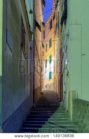 The old narrow street in the medieval Italian village of Manarola at night. Parco Nazionale delle Cinque Terre Liguria Italy.