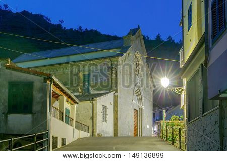 The old narrow street in the medieval Italian village of Manarola at night. Parco Nazionale delle Cinque Terre Liguria Italy.