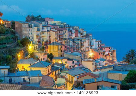 The old narrow street in the medieval Italian village of Manarola at night. Parco Nazionale delle Cinque Terre Liguria Italy.