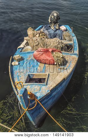 Small fishing boat with fishing net and equipment