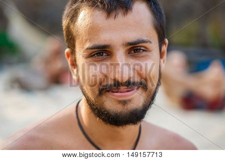 Portrait of a handsome man with black moustache and beard
