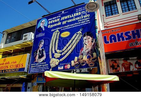 Georgetown Malaysia - January 8 2008: Colourful signs for Indian-owned jewelry and clothing shops on Lebuh Pasar Street in Little India