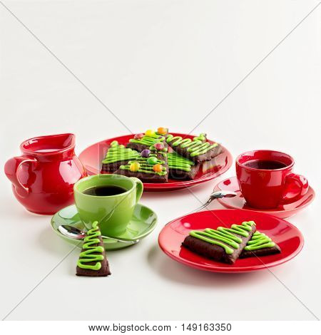 Breakfast. Coffee with honey-ginger cookies in the shape of a Christmas tree decorated with colorful jelly beans.