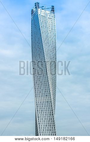 Dubai, UAE - May 2, 2013: Cayan Tower, or Infinity Tower, is a tower or spiral skyscraper located in Dubai Marina skyline. The Cayan Tower is the tallest building in the world with a twist of 90.