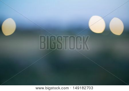 Abstract background - defocused evening countryscape with yellow blurs