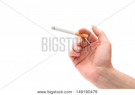 Female hand holding a cigarette over a white background