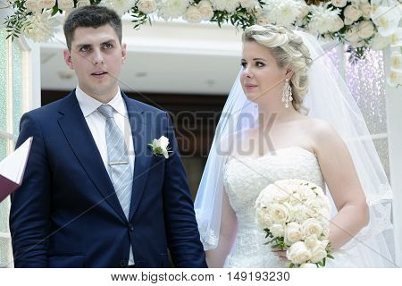 Beauty Bride And Handsome Groom Are Registering The Marriage. Wedding Couple Is Marrying. Beautiful