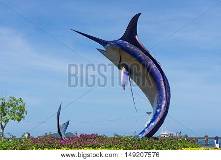 Kota Kinabalu, Malaysia - September 01, 2016: A Giant Swordfish Statue Stands In The Center Of A Rou