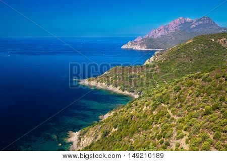 View from famous D81 coastal road with view of Golfe de Girolata from Bocca Di Palmarella Corsica France Europe.