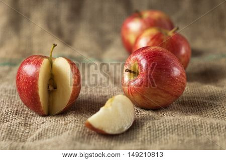 Tasty red apples whit slice on table.Organic food production