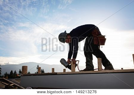 A carpenter working on a consruction site