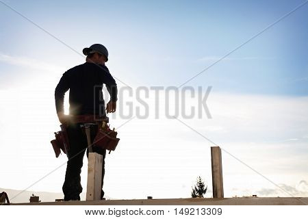 A carpenter working on a consruction site
