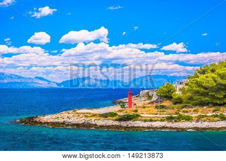 Waterfront view at seascape in Croatia, marble Adriatic sea and lighthouse at island, Europe.