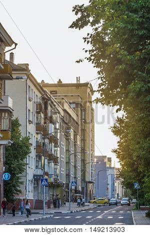 BELGOROD RUSSIA - SEPTEMBER 10 2016: Roadway Holy Trinity Boulevard in the center of Belgorod in the light of the low sun. Houses late Stalin era (mid 20th century) and modern buildings.