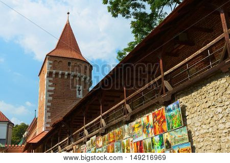 Krakow Poland - 2 September 2016: The city gates and the tower. The wall is decorated with paintings of local artists at Florianska street.