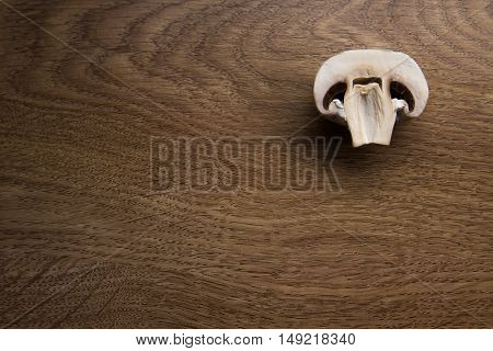 sliced tasty mushrooms on a wooden background