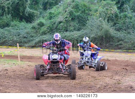 Unidentified Racer Rides A Quad Motorbike.