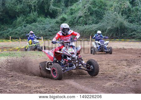 Unidentified Racer Rides A Quad Motorbike.
