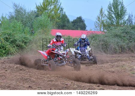 Unidentified Racer Rides A Quad Motorbike.