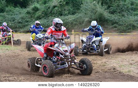 Unidentified Racer Rides A Quad Motorbike.