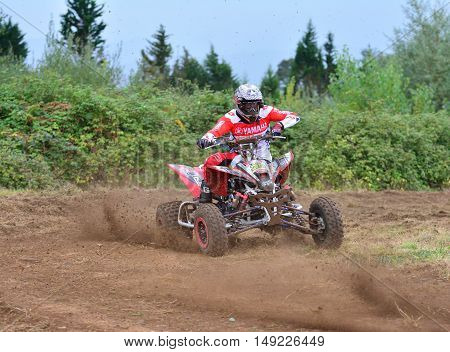 Unidentified Racer Rides A Quad Motorbike.