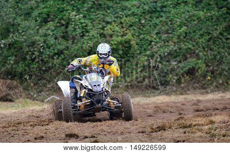 Unidentified Racer Rides A Quad Motorbike.