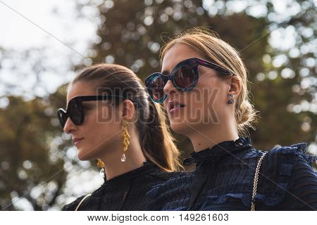 Fashionable Women Posing During Milan Fashion Week