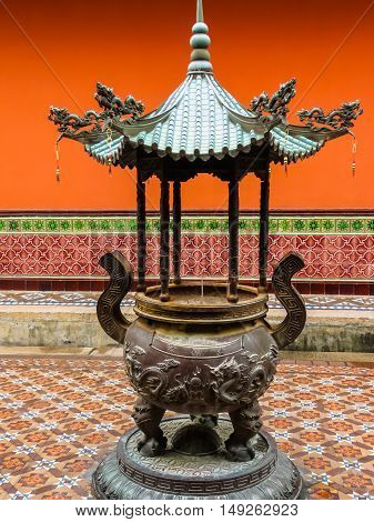 Pot for the burning sticks. Detail of Chinese Buddhist Temple