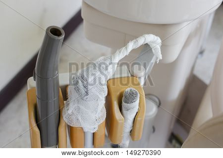 Medical equipment that with gauze wrap selective focus, Different dental instruments and specialized treat  types of disease teeth oral,soft-focus background