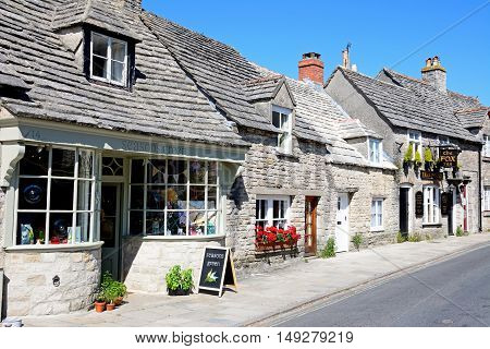 CORFE, UNITED KINGDOM - JULY 19, 2016 - The Fox Inn and shop along a village street Corfe Dorset England UK Western Europe, July 19, 2016.