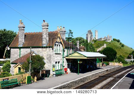 CORFE, UNITED KINGDOM - JULY 19, 2016 - View of the railway station with the castle to the rear Corfe Dorset England UK Western Europe, July 19, 2016.