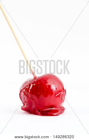 picture of a isolated toffee red apple on white background