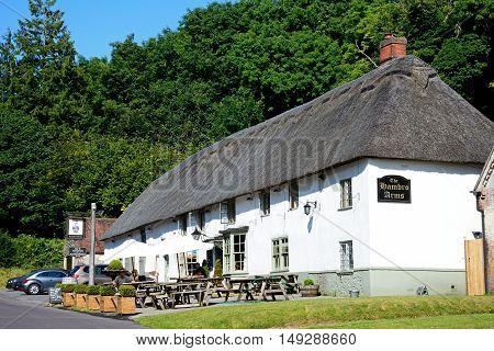 MILTON ABBAS, UNITED KINGDOM - JULY 19, 2016 - View of the Hambro Arms along the main village street Milton Abbas Dorset England UK Western Europe, July 19, 2016.