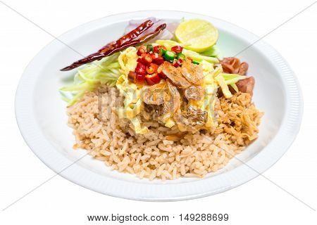 Fried rice shrimp paste with pork and fried egg isolated on white background. Fried rice with shrimp paste Thai style food.