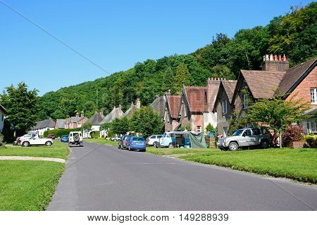 MILTON ABBAS, UNITED KINGDOM - JULY 19, 2016 - Pretty cottages along the main village street Milton Abbas Dorset England UK Western Europe, July 19, 2016.