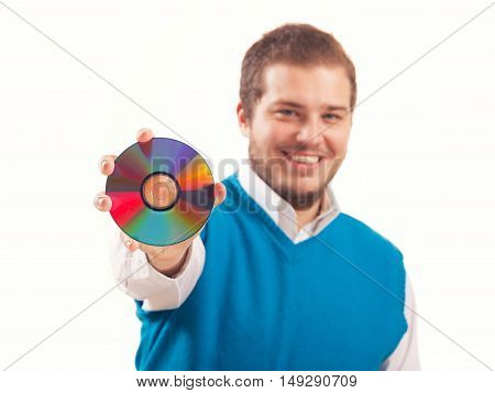 Young man holding a CD, studio shot