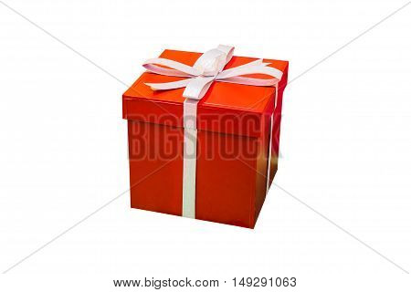 Red gift box isolated on white background. Christmas present wrapped in ribbon.