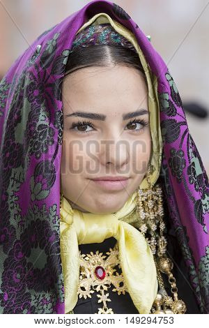 CAGLIARI, ITALY - May 1, 2014: 358 ^ Religious Procession of Sant'Efisio - Sardinia - portrait of a beautiful girl in traditional Sardinian costume