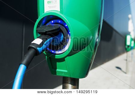 TILBURG, NETHERLANDS - SEPTEMBER 25, 2016: Electric vehicle charging station in  Tesla Supercharger Station of Tilburg, Netherlands.