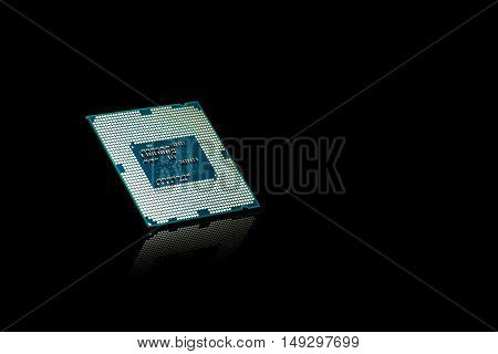 Computer processor chip CPU on black reflective background
