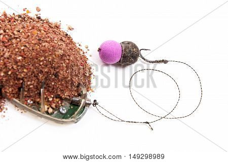 Dry Feed For Carp Fishing. Ready For Use Carp Bait With Fishing Flat Feeder For Carp Fishing Isolate