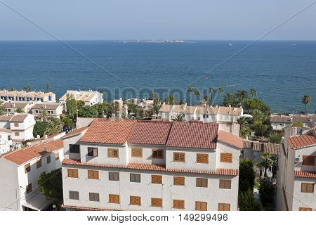 Views of Santa Pola town with Tabarca islet at the background. It is a coastal town located in the comarca of Baix Vinalopo in the Valencian Community Alicante Spain by de Mediterranean Sea.