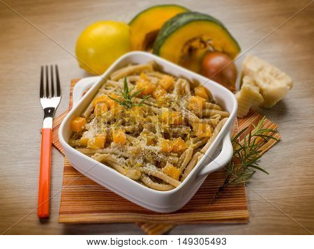 pasta casarecce with pumpkin, selective focus