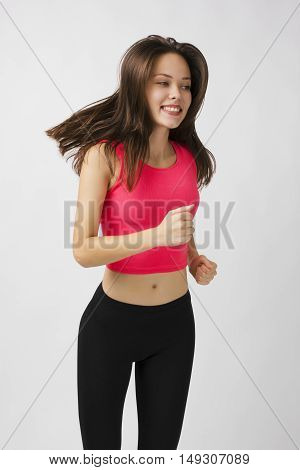 Girl in sport on a white background. He likes to work