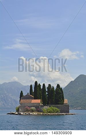 The tiny St George's Island in Kotor Bay Montenegro also known as the Island of the Dead. The island contains a 12th century Benedictine abbey and a cemetery.