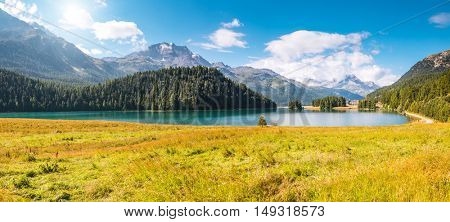 Great view of the azure pond Champfer in alpine valley. Popular tourist attraction. Picturesque and gorgeous scene. Location Swiss alps, Silvaplana village, district of Maloja, Europe. Beauty world.