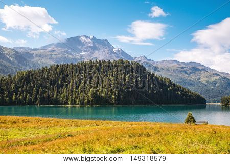 Great view of the azure pond Champfer in alpine valley. Popular tourist attraction. Picturesque and gorgeous scene. Location Swiss alps, Silvaplana village, district of Maloja, Europe. Beauty world.