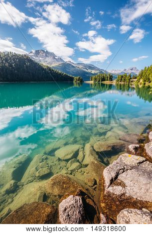 Great view of the azure pond Champfer in alpine valley. Popular tourist attraction. Picturesque and gorgeous scene. Location Swiss alps, Silvaplana village, district of Maloja, Europe. Beauty world.