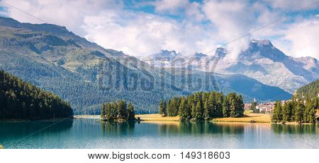 Great view of the azure pond Champfer in alpine valley. Popular tourist attraction. Picturesque and gorgeous scene. Location Swiss alps, Silvaplana village, district of Maloja, Europe. Beauty world.